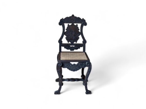 Noir Crest Chair with arched cane back and carved black frame