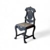 Black Rococo-style Noir Crest Chair with floral crest detail