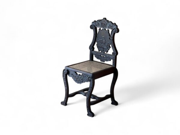Black Rococo-style Noir Crest Chair with floral crest detail