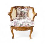 Rococo Armchair with carved wood frame and floral fabric