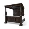 Luxury carved teakwood bed with ornate canopy