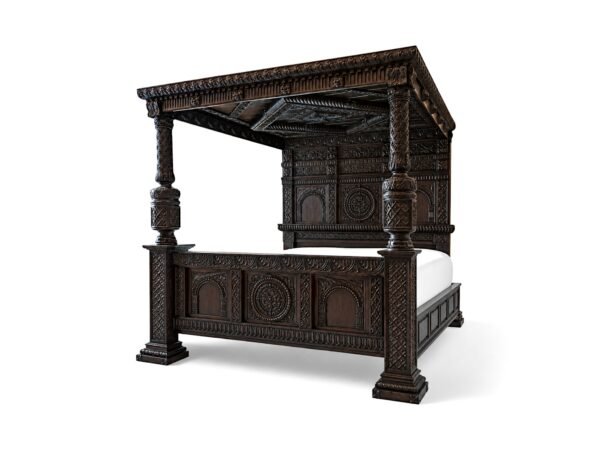 Luxury carved teakwood bed with ornate canopy