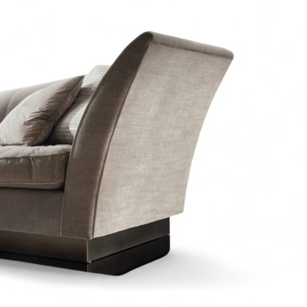 Modern three-seater sofa with flared armrests and cushions