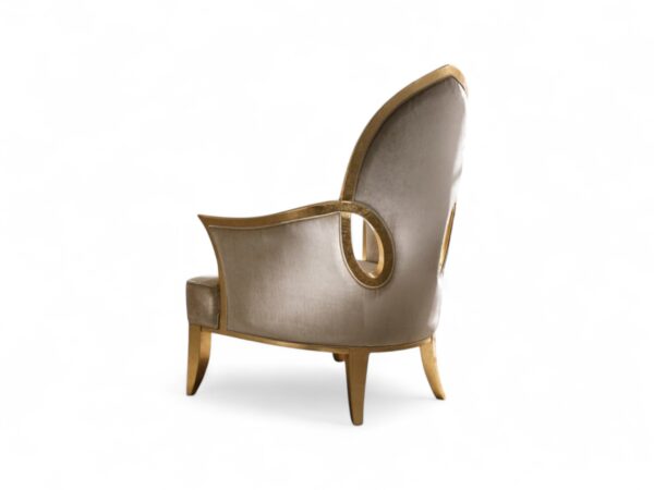 Luxurious velvet chair with gold leaf accents and plush design