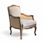 Classic Venetian Armchair with ornate wood carving and neutral upholstery