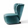 Teal velvet armchair with rounded base and elegant silhouette
