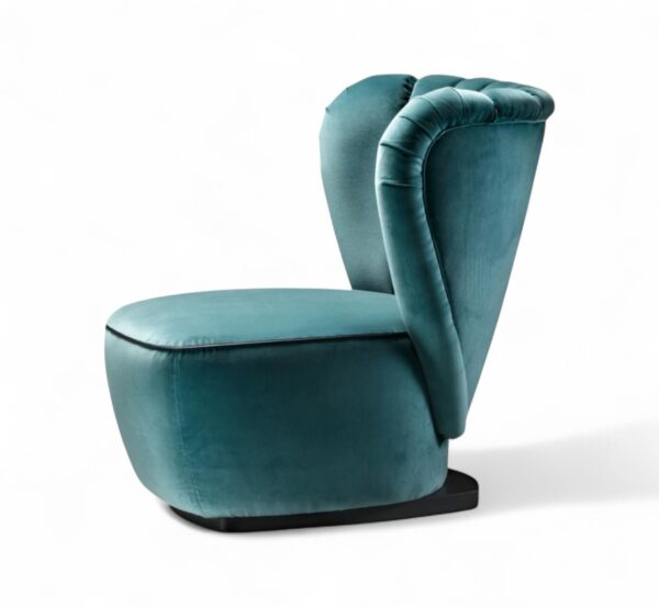 Teal velvet armchair with rounded base and elegant silhouette