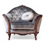 Carved Louis armchair with silver velvet and wood frame