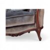 French-style velvet armchair with button tufting and curved back