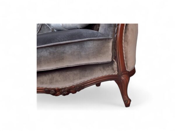 French-style velvet armchair with button tufting and curved back