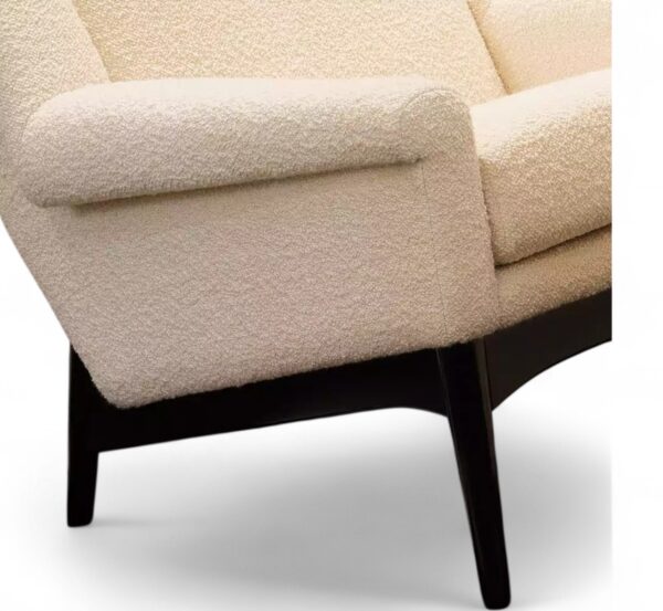 Cream boucle armchair and ottoman with sculpted wooden base