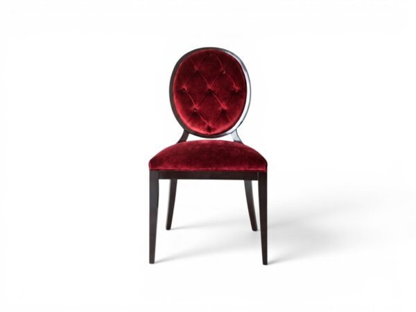 Red velvet dining chair with button-tufted back and wooden frame