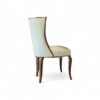 Elegant high-back dining chair with soft upholstery and sleek wood