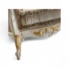 Opulent accent chair with gold leaf detailing and rolled arms