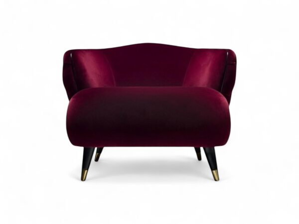 Modern red velvet accent chair with plush, sculpted design