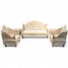 Ornate wooden sofa set with intricate carvings and polished finish