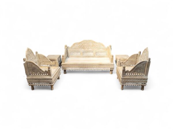 Ornate wooden sofa set with intricate carvings and polished finish
