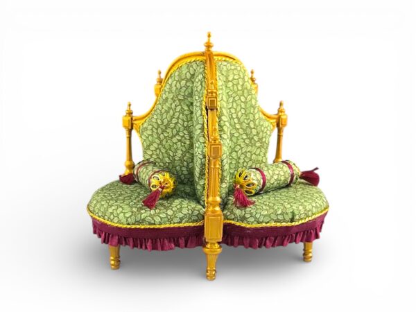 Antique-style Victorian tête-à-tête chair with maroon tasselled cushions