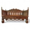 Traditional wooden divan with detailed hand-carved patterns