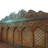 Heritage Wooden Divan with intricate lattice backrest and ornate carvings