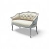 Vintage-style loveseat with luxurious upholstery and detailed woodwork