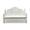 Luxurious hand-carved daybed with white finish, ideal for royal-inspired interiors