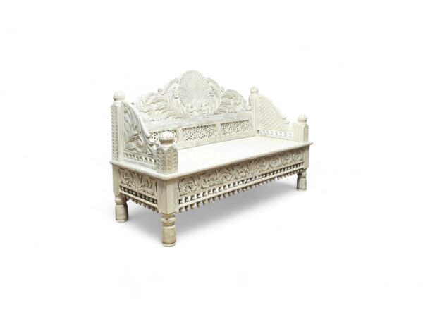 Ornate wooden daybed featuring traditional Maharaja-style carvings