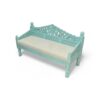 Handcrafted wooden settee with detailed carvings and neutral cushion
