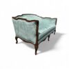 Side view of aqua blue French sofa with curved legs and arms