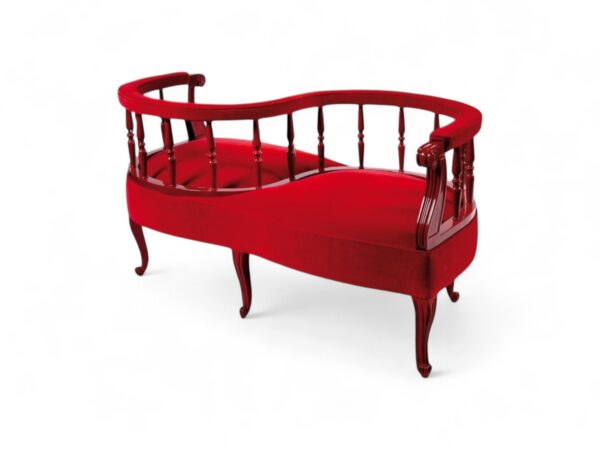 Victorian Conversation Settee with red upholstery and carved wooden frame