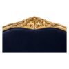 Antique-style French sofa with ornate wooden frame and plush velvet