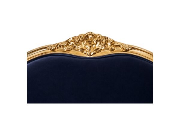 Antique-style French sofa with ornate wooden frame and plush velvet