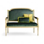 Emerald Velvet Settee with gold-carved wooden frame and soft green cushions