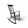 Sleek Spindle Rocker with handwoven cane seat and black frame