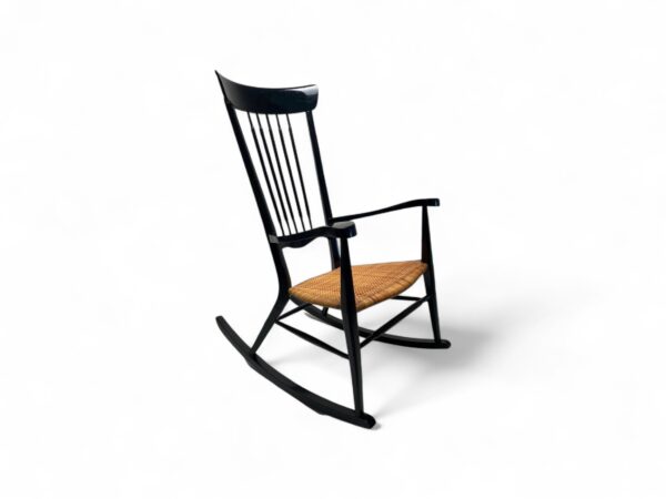 Sleek Spindle Rocker with handwoven cane seat and black frame