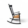 Minimalist wooden rocking chair with slim spindle back