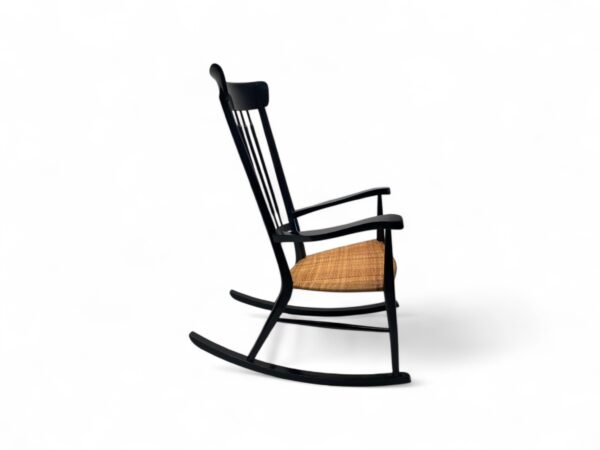 Minimalist wooden rocking chair with slim spindle back