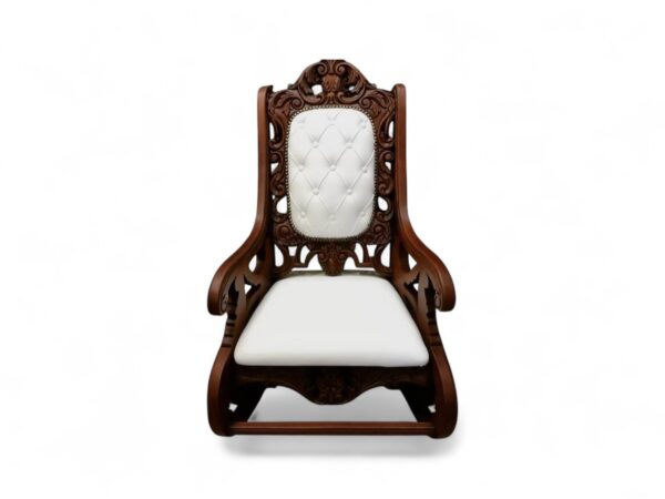 Hand-carved wooden rocking chair in ivory upholstery