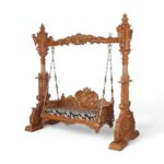 Side view of Regal Lotus Carved Swing showcasing detailed hand-carved pillars