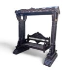 Front view of handcrafted wooden swing with dark finish and carved pillars