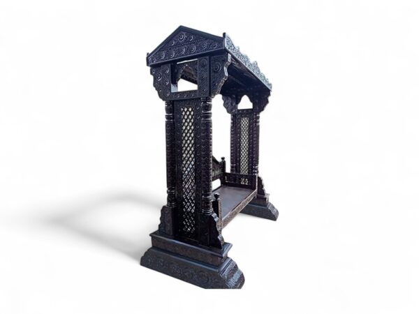 Side angle of Majestic Heritage Carved Swing highlighting the carved backrest and structure