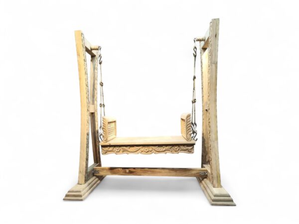 Front view of handcrafted white teak wood swing with floral carvings