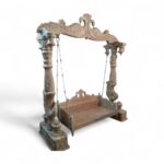 Traditional wooden jhula with antique polish and royal peacock carving