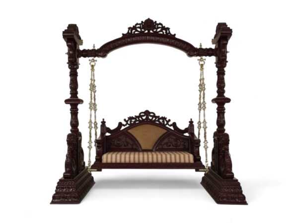 Front view of Maharaja Carved Swing highlighting carved arch and cushioned seat