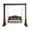 Full frame of Royal Hand-Carved Swing with ornate pillars and hanging seat