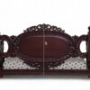 Close-up of Victorian Style Swing backrest with detailed carvings and fabric upholstery