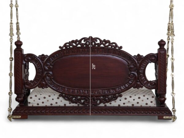 Close-up of Victorian Style Swing backrest with detailed carvings and fabric upholstery