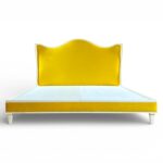 Soleil Curve Bed in vibrant yellow velvet with arched headboard