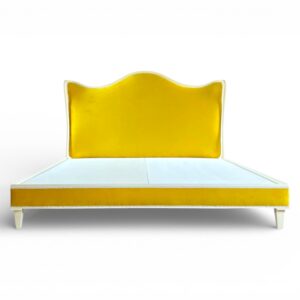 Soleil Curve Bed in vibrant yellow velvet with arched headboard