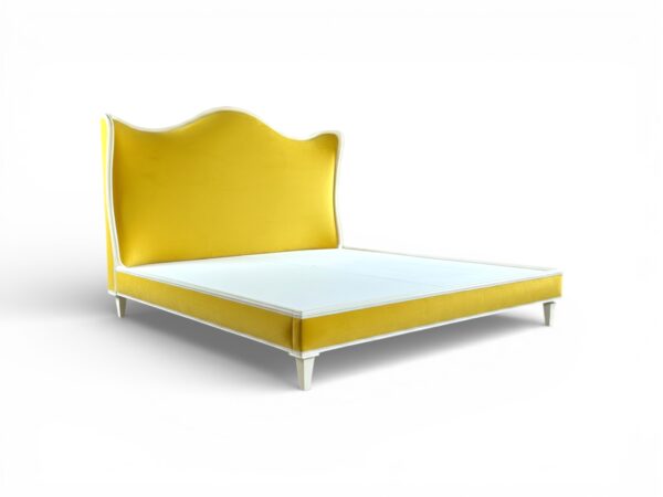 Sculptural yellow velvet bed with ivory piping and tapered legs